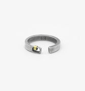 this adjustable, 5mm-wide hand-forged open sterling silver ring is accented with an 18k gold hoop