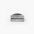 this distressed double bar ring features two wide, parallel sterling silver bands connected by a ruby accent. its rugged, hand-forged texture enhances the raw, sculptural feel of the design