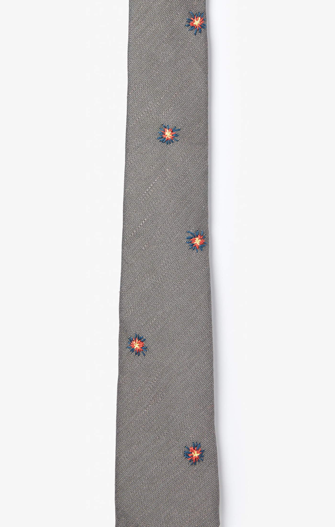 embroidered sunbursts are scattered on this necktie