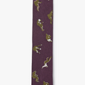 custom woven italian silk tie features silhouettes of falling men. it is finished with contrasting embroidered outlines