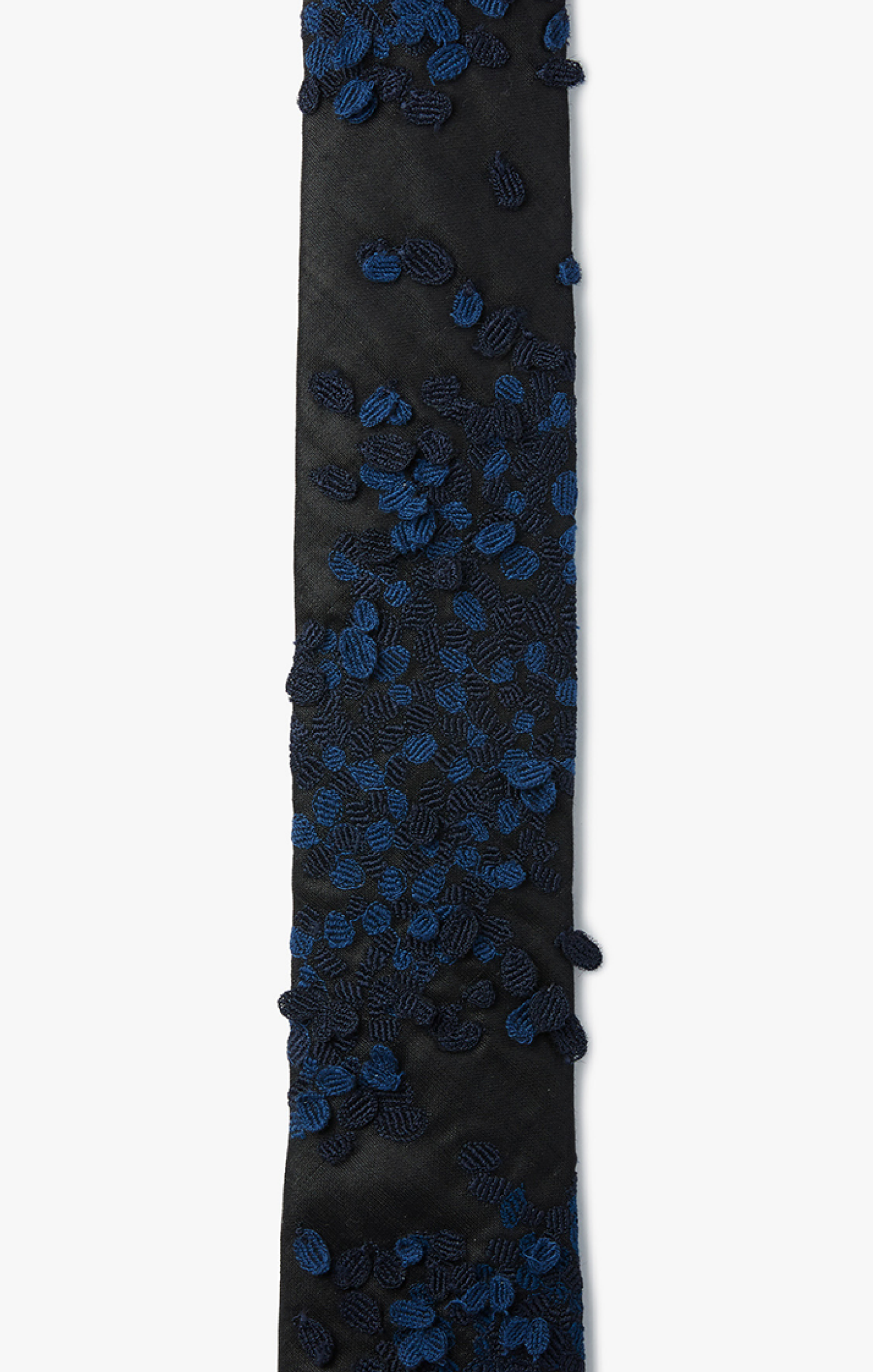 magnified stained pollen cells are scattered and hand beaded in multiple colors on black wool