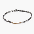 adjustable bracelet consists of an 18k gold asymmetrical bar that connects to a sterling cable chain