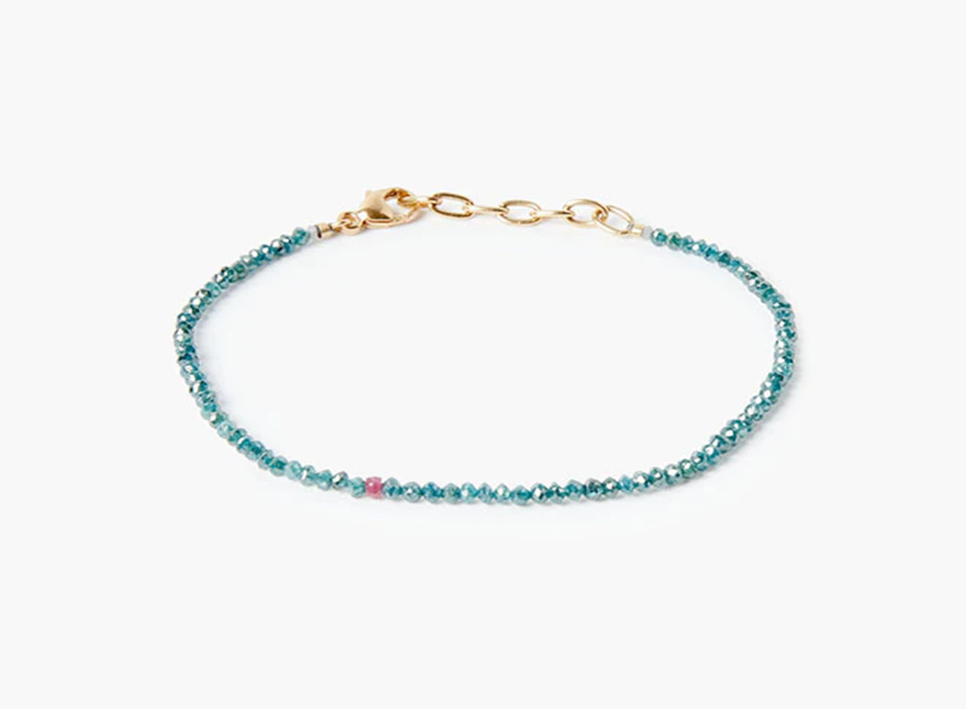 adjustable bracelet features 2mm blue diamonds that are finished with an 18k gold cable chain and our signature singular ruby