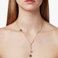 lariat necklace features a series of 5x3 mm and 6x4mm emerald-cut gemstones that pivot within frames on an 18k ball chain