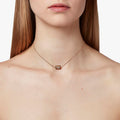 18k gold necklace features an 8x6mm emerald-cut gemstone that pivots within a rectangular frame on an 1.5mm ball chain