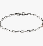 MIXED METAL BRACELET 034: a single 18k rose gold link complements a sterling anchor cable, fastened by a carabiner lobster clasp