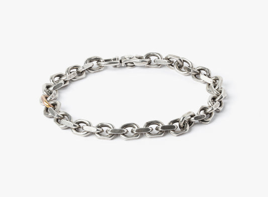MIXED METAL BRACELET 035: this adjustable sterling cable chain is offset by a single 18k rose gold link