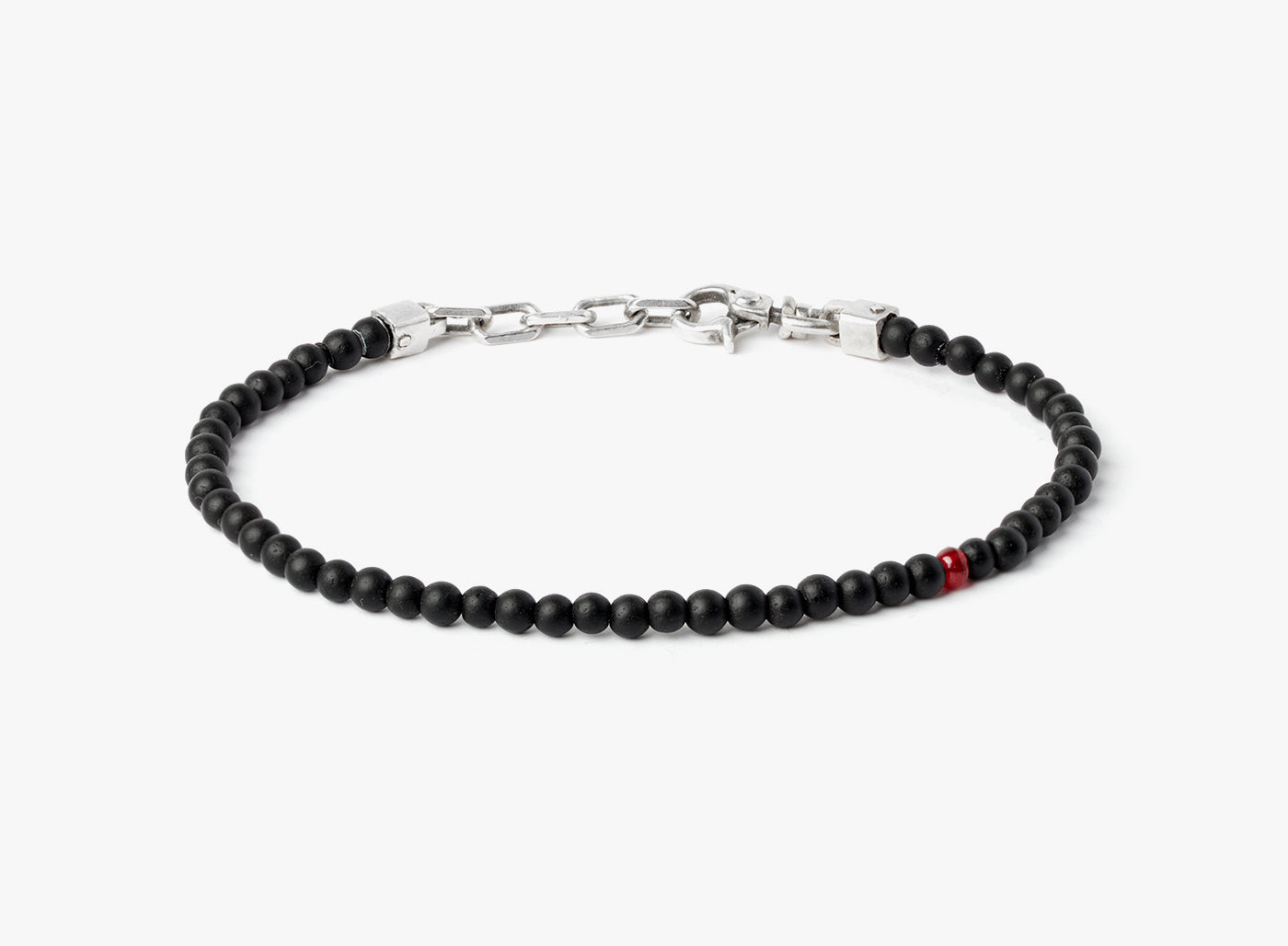 adjustable onyx stone bracelet is finished with a signature single ruby