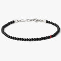 adjustable onyx stone bracelet is finished with a signature single ruby