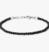 adjustable onyx stone bracelet is finished with a signature single ruby