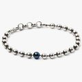 BEADED STONES BRACELET 185: this bracelet is composed of small sterling balls & a singular 6mm black pearl, and is fastened by a carabiner lobster clasp. 