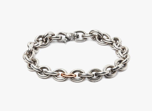 MIXED METAL BRACELET 189: this bracelet is composed of large sterling cable links and a single 18k rose gold link, fastened by a carabiner lobster clasp