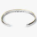 dual bracelet features an 18k gold wire that sits along a sterling cuff