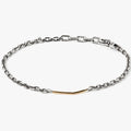 adjustable micro cable chain connects to a hand forged 18K gold bar