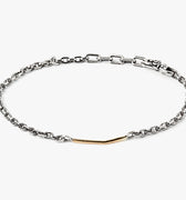 adjustable micro cable chain connects to a hand forged 18K gold bar