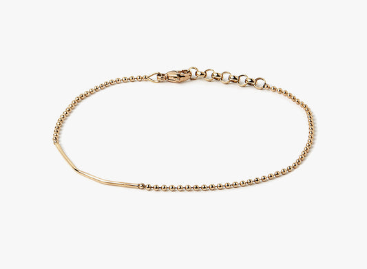 18K SOLID YELLOW GOLD BRACELET 262: this refined asymmetrical bar is offset on an 18K gold ball chain