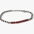 adjustable bracelet features a a sterling ball chain that connects to a 1.5" strand of 3mm garnet beads and finished with a single ruby