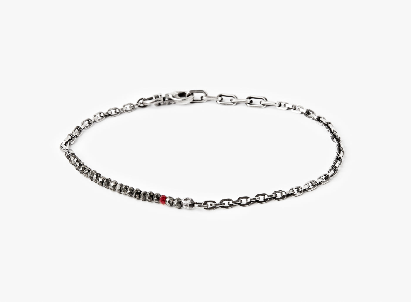 BEADED STONES BRACELET 308: this adjustable solid sterling flat cable chain connects to a strand of pyrite stones, finished with a single ruby