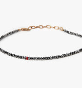 BEADED STONES BLACK DIAMOND BRACELET 313: this adjustable black diamond bracelet is finished with an 18k gold anchor chain and a single ruby