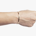 18K SOLID BRACELET 342: this flat gold cuff is hand forged in our our lower east side studio using reclaimed 18k gold
