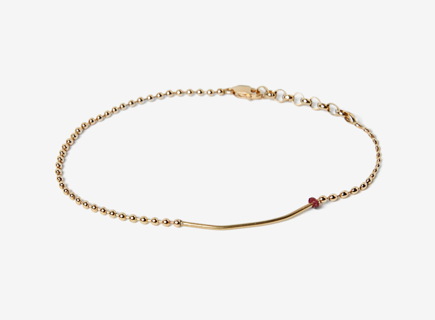 18K SOLID BAR W/ RUBY BRACELET 357: an 18k gold bar connects to a single red ruby and an 18k gold ball chain