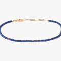 BEADED STONES LAPIS BRACELET 370: this 18k gold adjustable lapis stone bracelet is finished with a signature single ruby.
