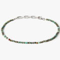 adjustable african turquoise stone bracelet is finished with a signature single ruby