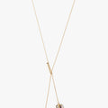 18k gold asymmetrical lariat necklace features pivoting emerald-cut smoky quartz (14x10mm) and amethyst (8x6mm) stones