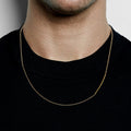 18k gold multi-chain necklace features a one and a half inch hand forged bar that connects to a cable and bead chain