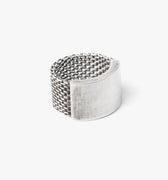 unique adjustable ring features an engineered mesh band that expands and contracts into the solid curved bar