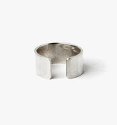 12.5mm x 1.25mm adjustable, open ended ring is hand forged in our lower east side studio using reclaimed sterling silver, which is then oxidized - resulting in a darkened finish that will wear over time to a lighter, contrasting patina