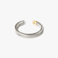 adjustable open ended sterling silver ring is finished with a chunk of 18k gold