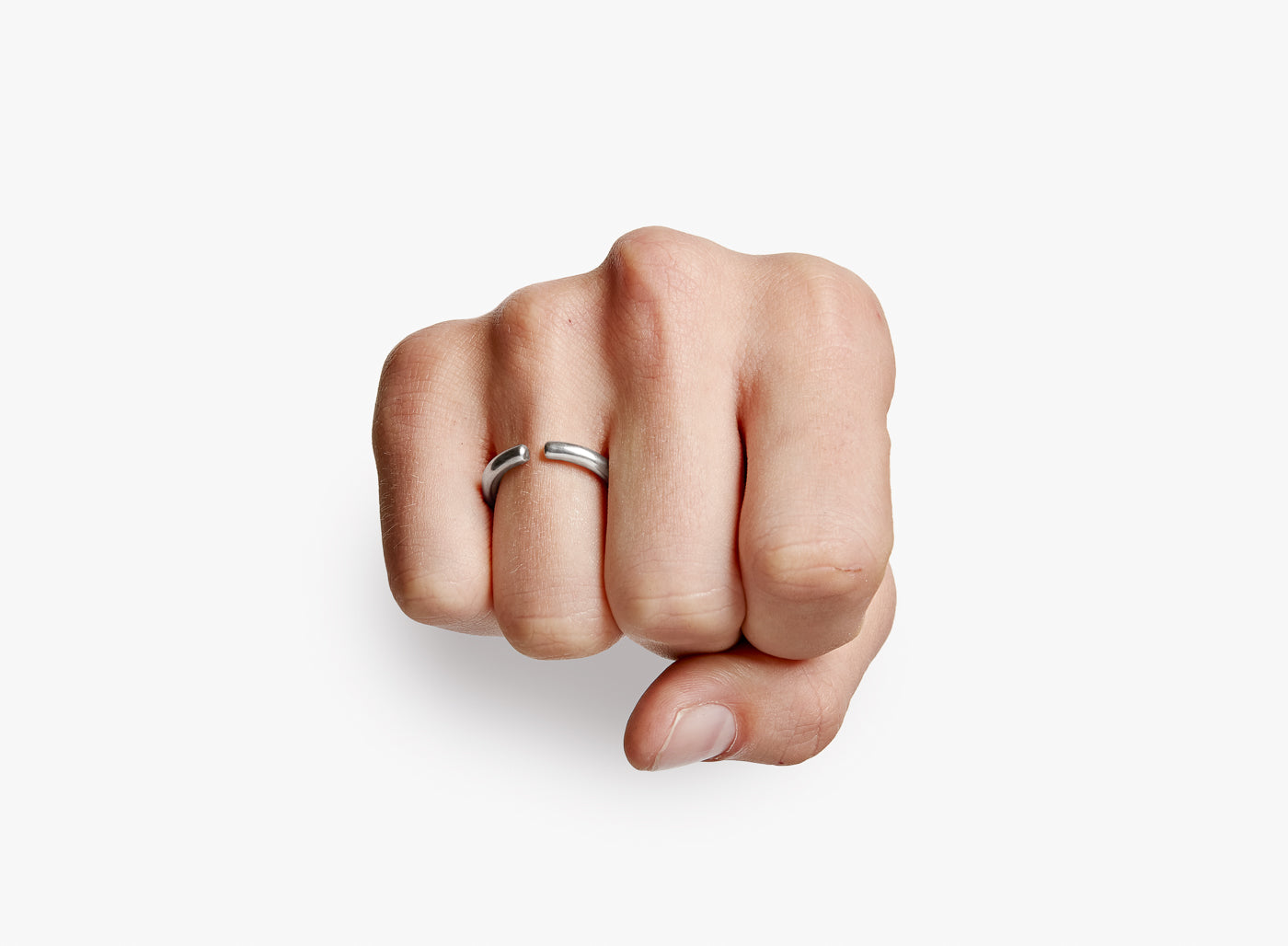 adjustable sterling open-ended ring is hand forged in our lower east side studio. it is made from reclaimed sterling silver, which is then oxidized - resulting in a darkened finish that will wear over time to a lighter, contrasting patina