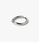 adjustable sterling open-ended ring is hand forged in our lower east side studio. it is made from reclaimed sterling silver, which is then oxidized - resulting in a darkened finish that will wear over time to a lighter, contrasting patina