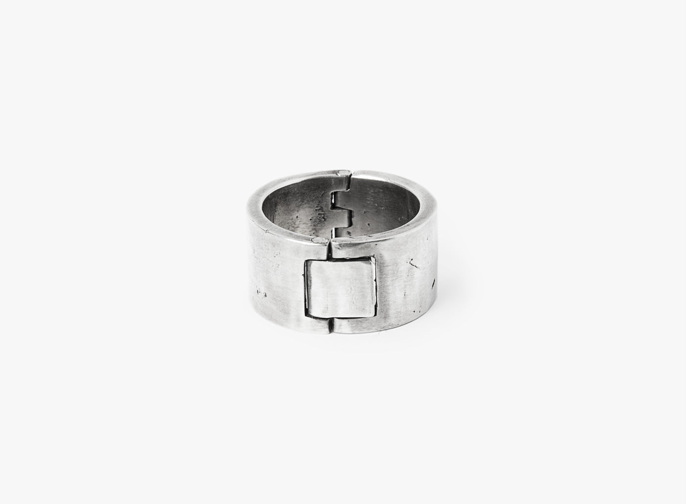 solid riveted sterling ring opens with a functional square clasp