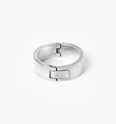 solid riveted sterling ring opens by a custom rectangular clasp. it is individually handmade in our New York City atelier, using recycled sterling silver