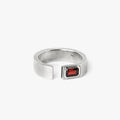 open signet ring is hand forged and finished with an emerald-cut garnet stone