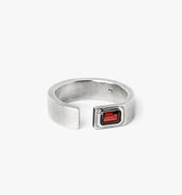 open signet ring is hand forged and finished with an emerald-cut garnet stone