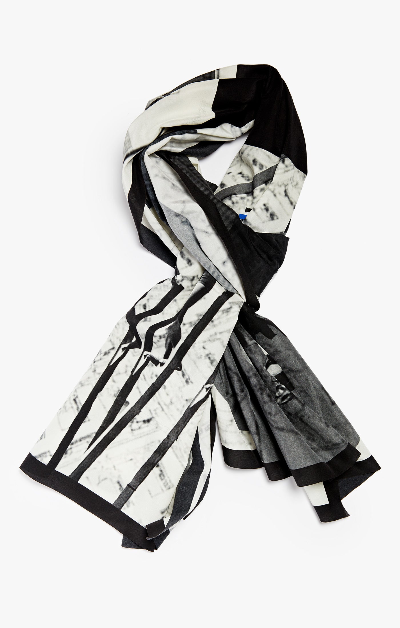 a 1920's collage, this scarf is made of a silk cotton blend. it is digitally printed in como, italy and finished with a raw, laser cut edge