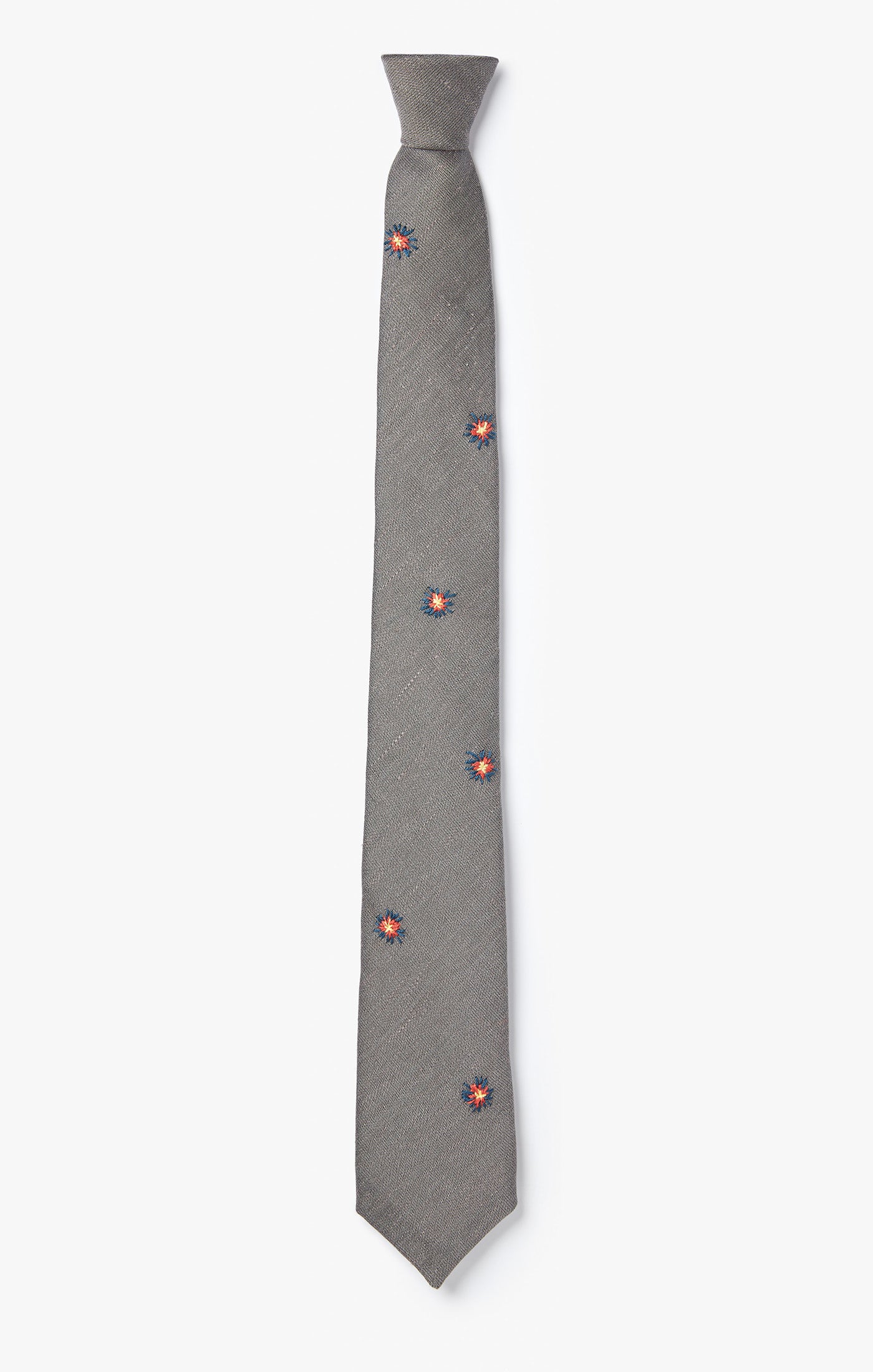 embroidered sunbursts are scattered on this necktie