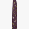 custom woven italian silk tie features silhouettes of falling men. it is finished with contrasting embroidered outlines