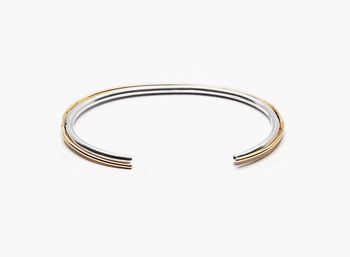 hinged cuff is made with 18k yellow gold &amp; sterling silver