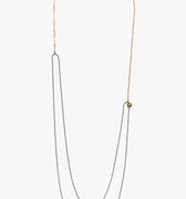 18k gold cable chain connects to a double wrap sterling bead chain and is finished with a thumbprint detail